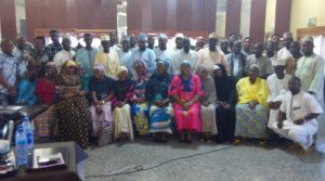 Participants at the discussion roundtable in a group picture shortly after the event