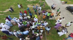 A drone camera arial shot of BUK students planting the trees