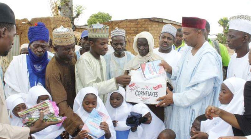 Student's of Shara community's under-tree school receiving sets of uniforms and learning materials donated to them by CITAD