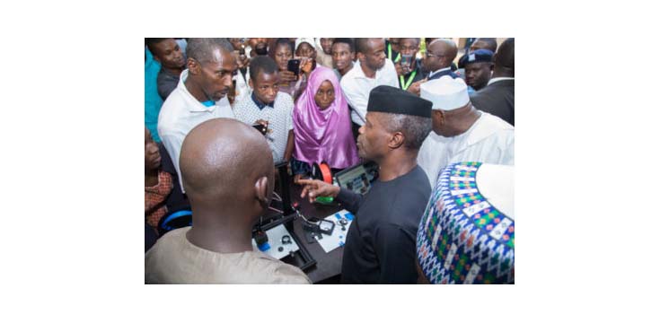 Nigeria's Vice President Yemi Osinbajo chatting with the student innovators and enterpreneurs